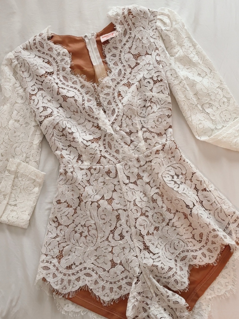 Showpo White Lace Long Sleeve Romper with Nude Lining